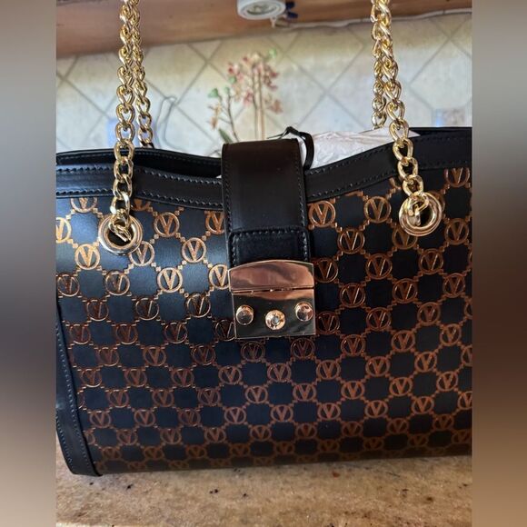 Mario Valentino signature embossed bag. NWT and dust bad. Black with bronze - Picture 2 of 7